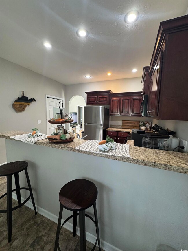 Kitchen featuring recessed lighting, a peninsula, 