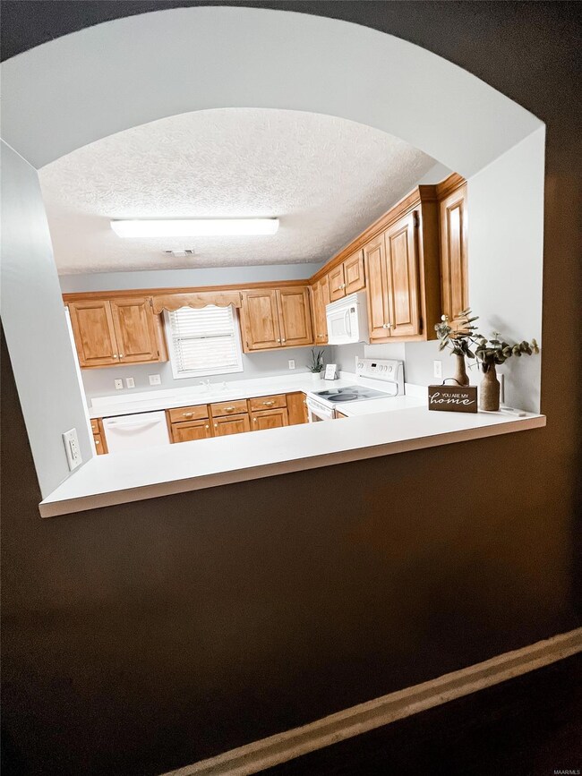 Beautiful arched detail connecting the kitchen and
