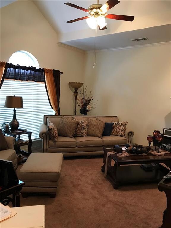LIVING ROOM FEATURES VAULTED CEILING W/FAN AND LAR
