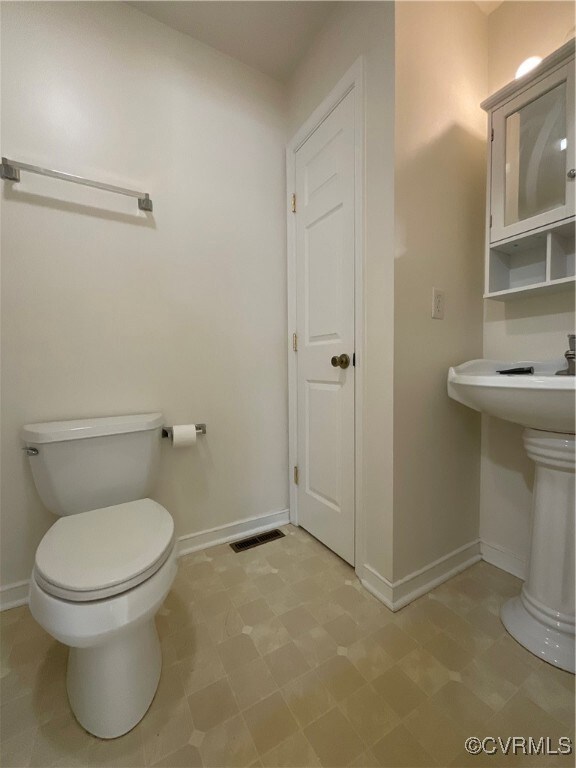 Hall Bathroom with sink and toilet