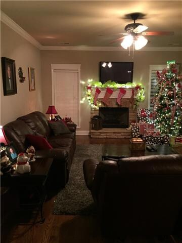 ~View of the Family room from Foyer. Nice stone fireplace~