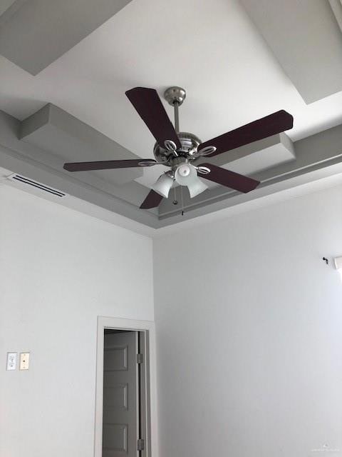 Interior details featuring visible vents and a ceiling fan