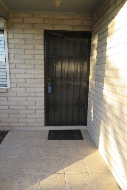 Security screen door at front entry