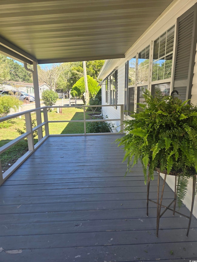 Deck featuring a yard