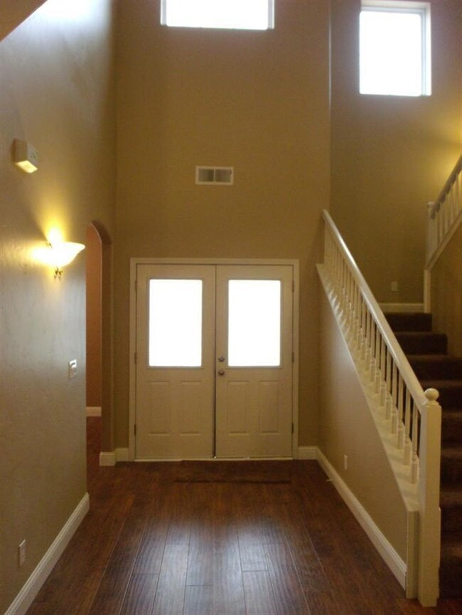 Looking back into entry with stairway to right and