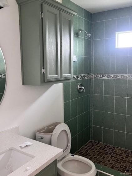 Full bath with vanity and a shower stall