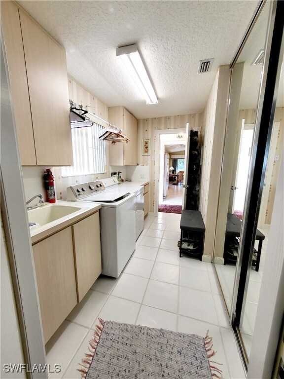 Laundry room featuring wood walls, independent was