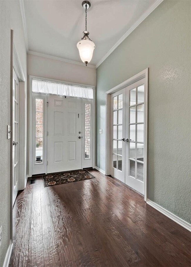 Spacious entry with french double doors into the dining room & office/media room.