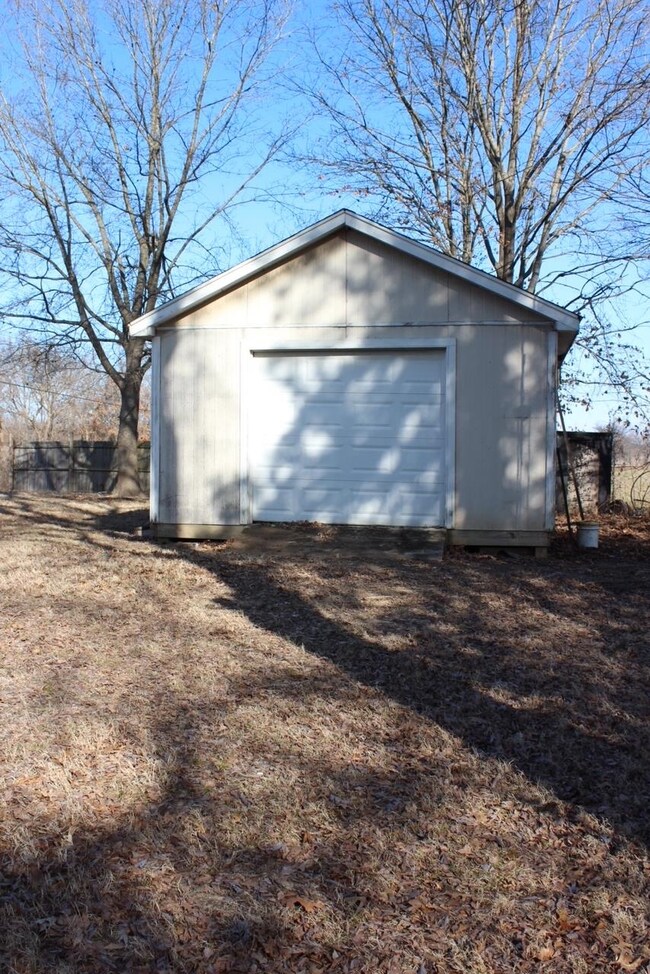 View of garage with electricity and HVAC