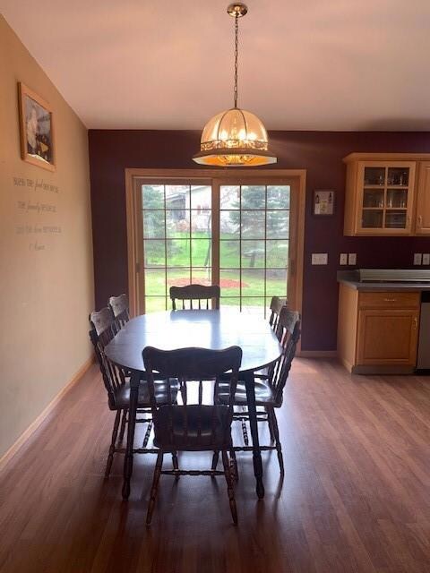 Dining area to back patio with views of a double l
