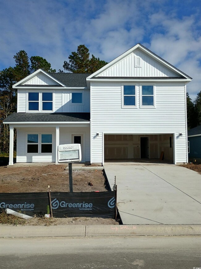 View of front facade with a garage