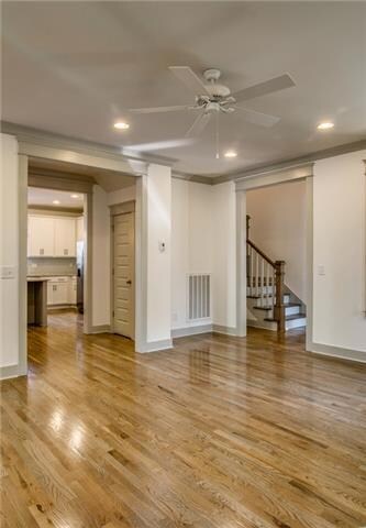 Beautiful living room space with charming fireplace.  (Photo of a similar home by BM)