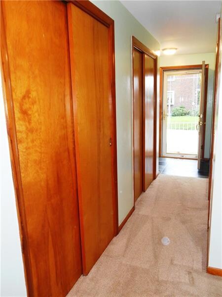 The hallway from the bedrooms to the front is line