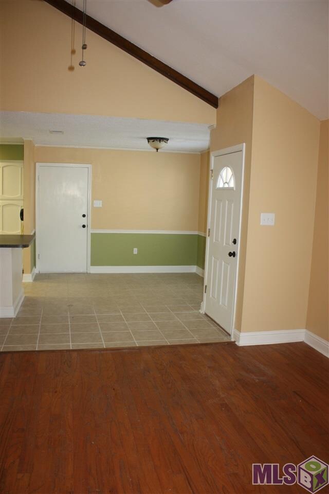 Living room looking into kitchen/dining area