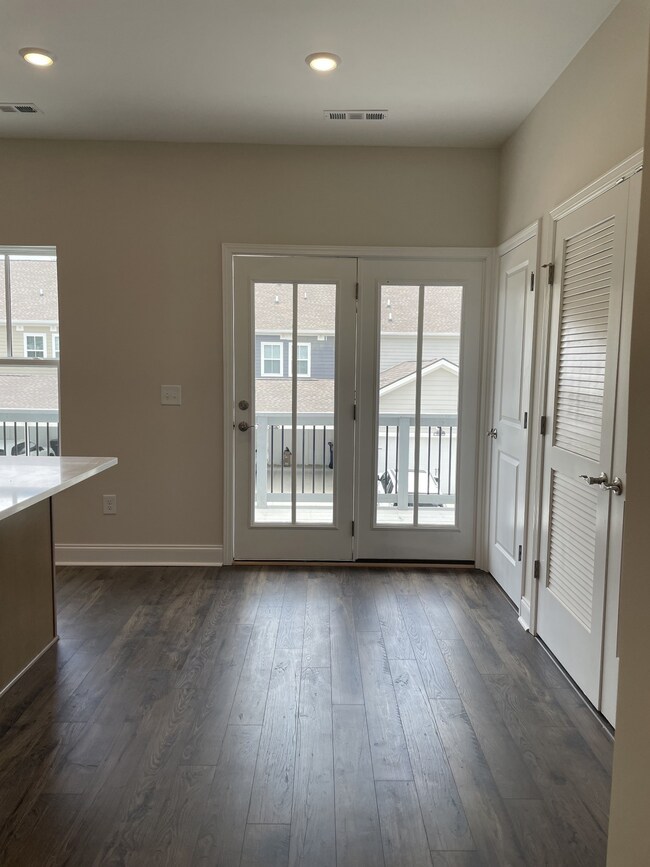 Gorgeous kitchen with lots of natural lighting.  French doors out to your deck