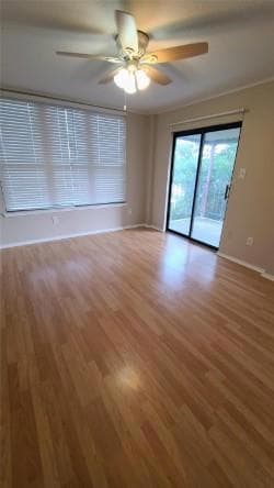 Empty room featuring light wood-style flooring, b