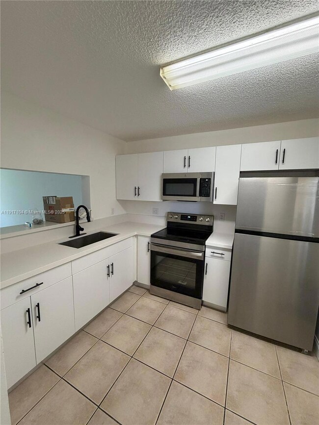 2401 NW 56th Ave unit 3-103, Lauderhill, FL 33313 - photo 2