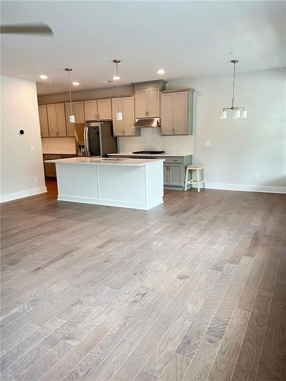 Kitchen with stainless steel fridge with ice dispe
