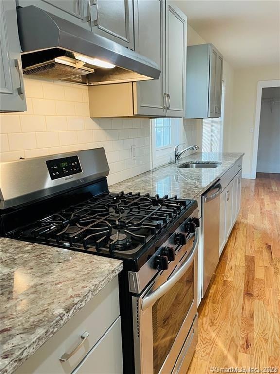 recently renovated kitchen has granite countertops
