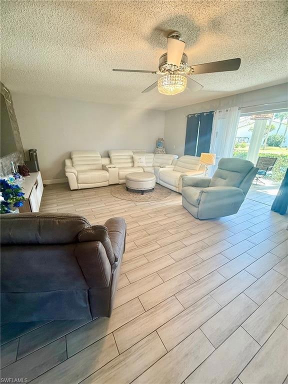 Living area with ceiling fan, wood finish floors, 
