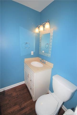 POWDER ROOM: Located off the Den. Freshly Painted.