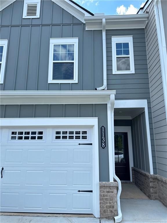 View of front of property featuring board and batt