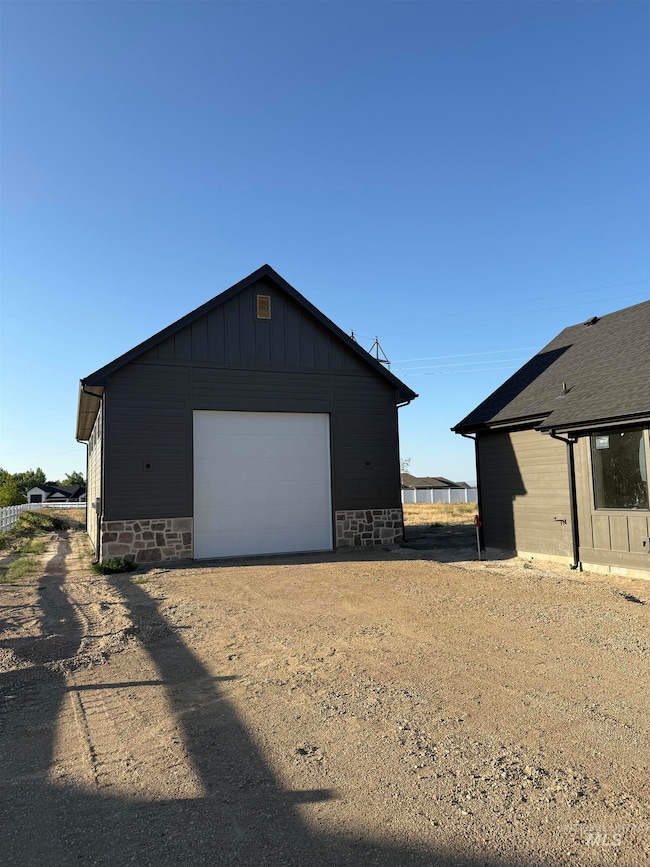View of outbuilding with driveway