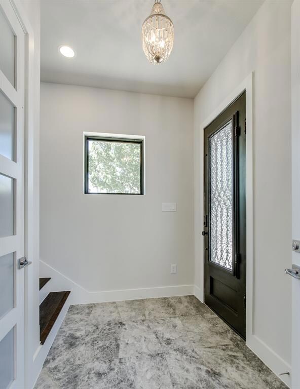 Marble Entry, Owners Elevator and Large Enrty Closet Greet you Upon Entry.