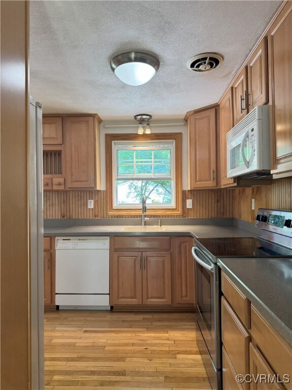 Kitchen with stainless steel appliances, a sink, a