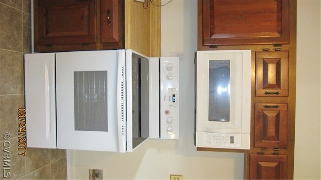 New range and microwave. New vinyl flooring.