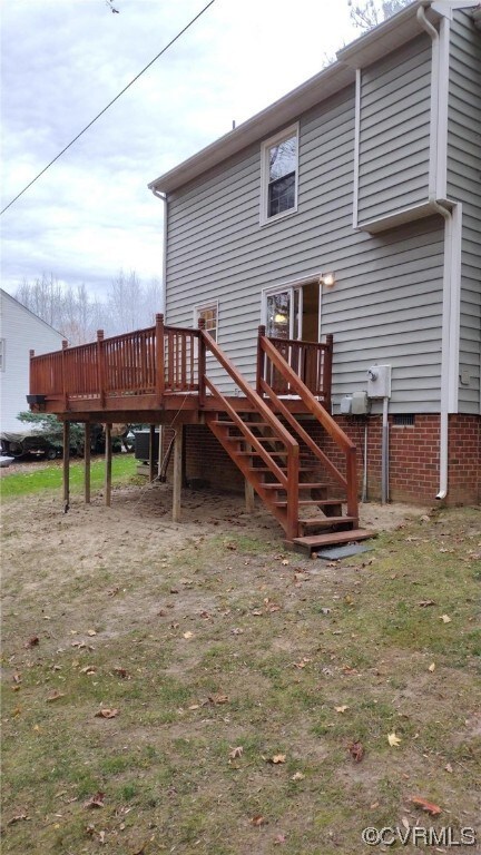 Rear view of property featuring a deck