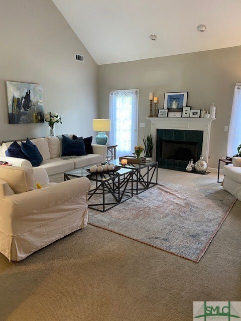 Living room with fireplace and two doorways to the