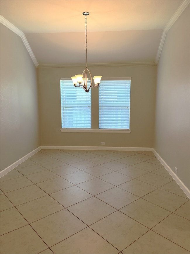 Dining room is further down the entry hall.