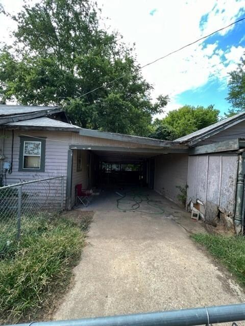 Carport between house and shed