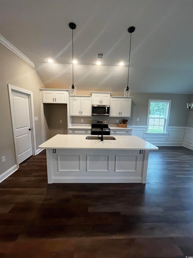 Kitchen with stainless steel appliances, a sink, a