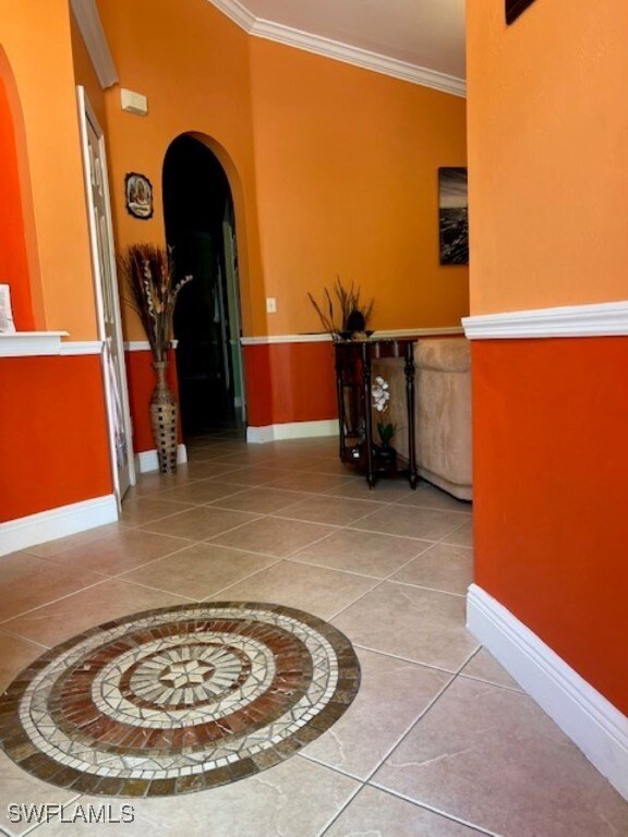 Corridor with arched walkways, crown molding, base