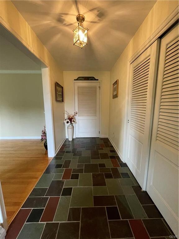 Foyer with slate floor and coat closet