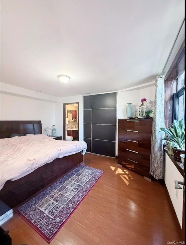 Bedroom featuring wood finished floors