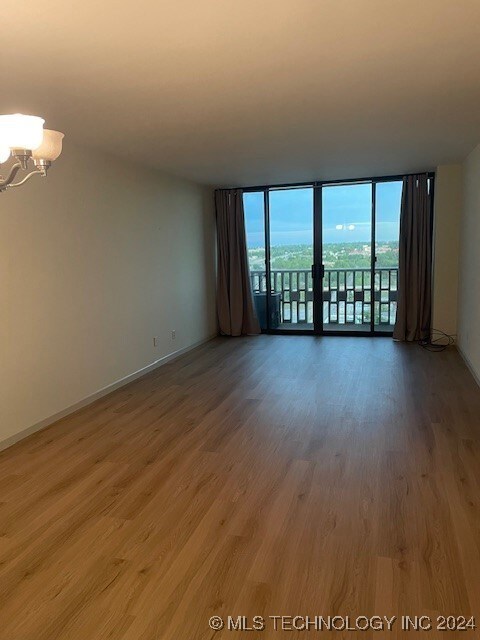 open living/dining with east facing balcony and ne