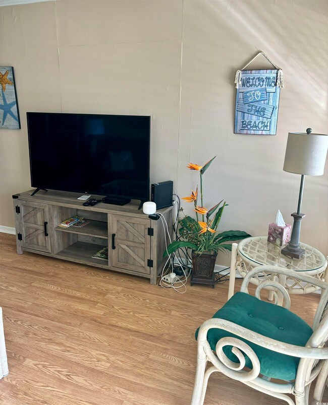 Living room with hardwood / wood-style floors