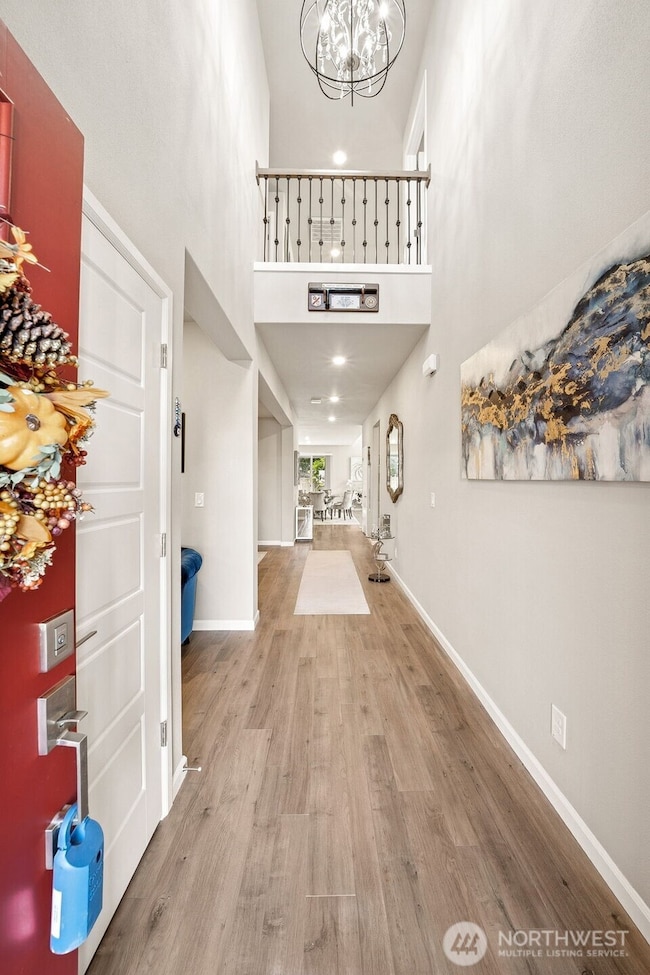 Two story entry with designer lighting & 2nd floor balcony