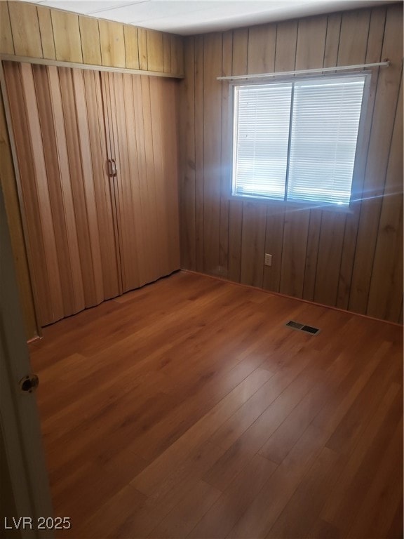 Unfurnished bedroom featuring light wood-style flo
