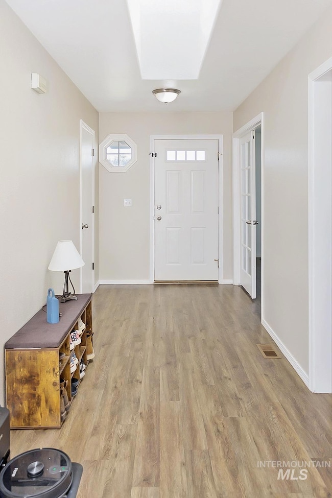Entryway with wood finished floors