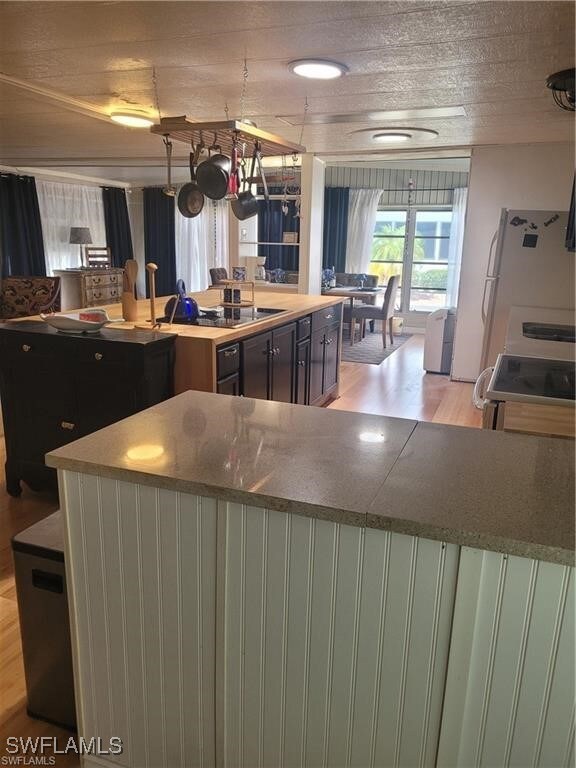 Kitchen featuring range, light wood finished floor