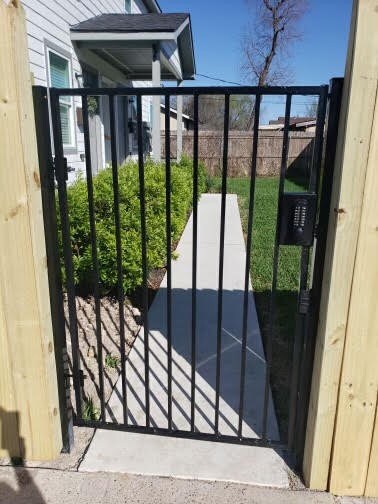 New entry gate for controlled access from the parking lot.