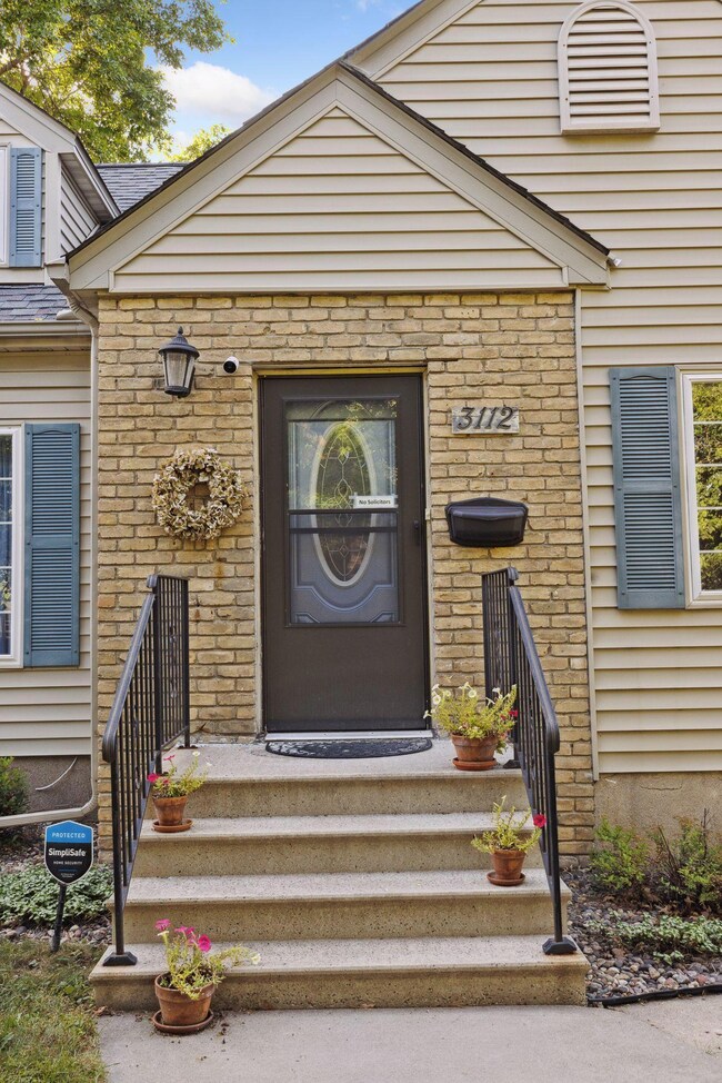Charming front entrance provides wonderful curb appeal