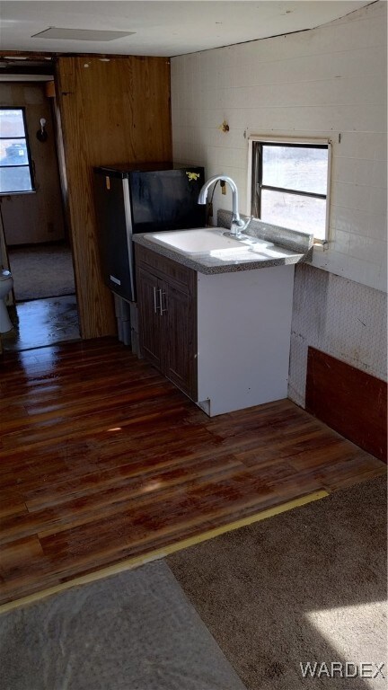 Kitchen featuring a sink, plenty of natural light,