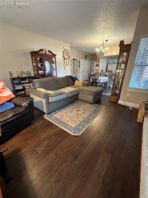 Living room with a textured ceiling, a notable cha