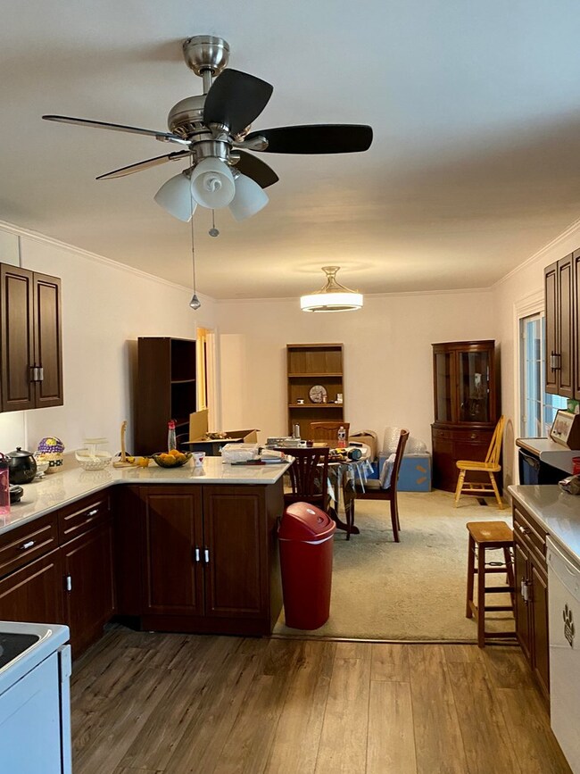 Kitchen has breakfast bar and dining area