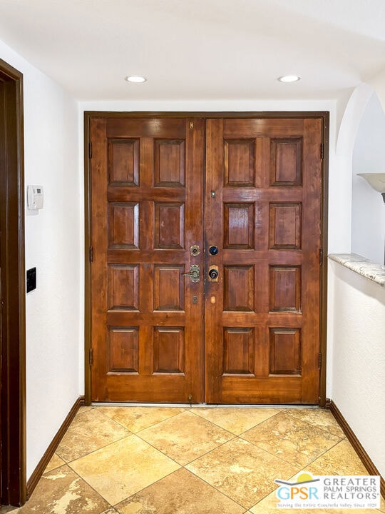 Elegant front foyer with double door entry